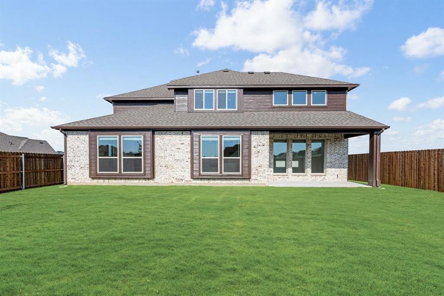 Front exterior of a new home in Wildflower Ranch 60-65, Justin, TX, highlighting curb appeal (Image 2). Front exterior of a new home in Wildflower Ranch 60-65, Justin, TX, highlighting curb appeal (Image 2).