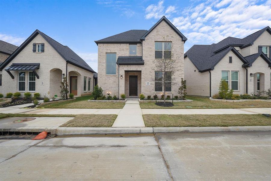 Front exterior of a new home in Cottages of Celina, Celina, TX, highlighting curb appeal (Image 27).