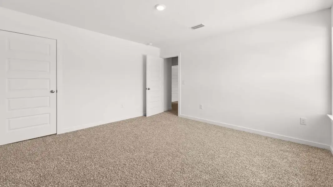 Spacious, unfurnished interior of a new home in Magnolia at the Bluffs Phase 3, Freeport (Image 19).