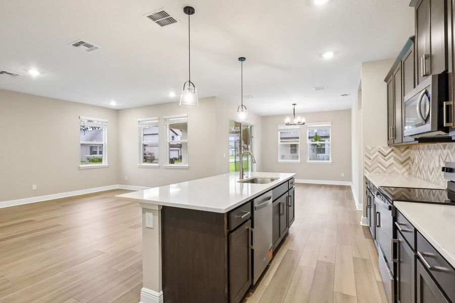 Furnished interior view inside a new home in Legends Preserve - Signature Series, Daytona Beach (Image 5).