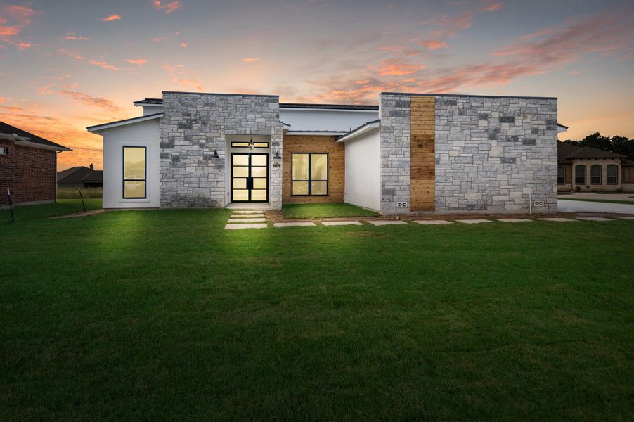 Representative exterior photo of a completed home built from the The Scottsdale 5000 by Whitestone Custom Homes in Johnson Ranch, Bulverde, TX (Image 21).