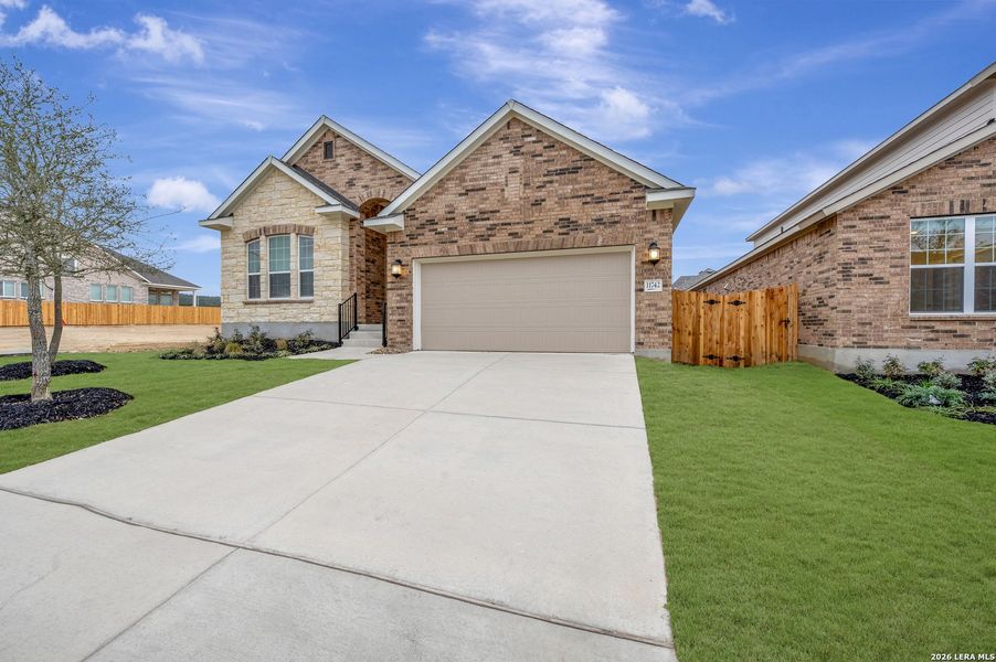 Front exterior of a new home in Davis Ranch 50', San Antonio, TX, highlighting curb appeal (Image 20).