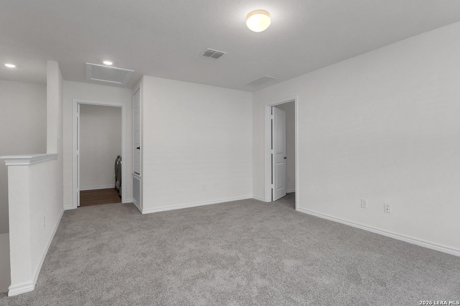 Spacious, unfurnished interior of a new home in Preserve at Culebra - Heritage Collection, San Antonio (Image 9).