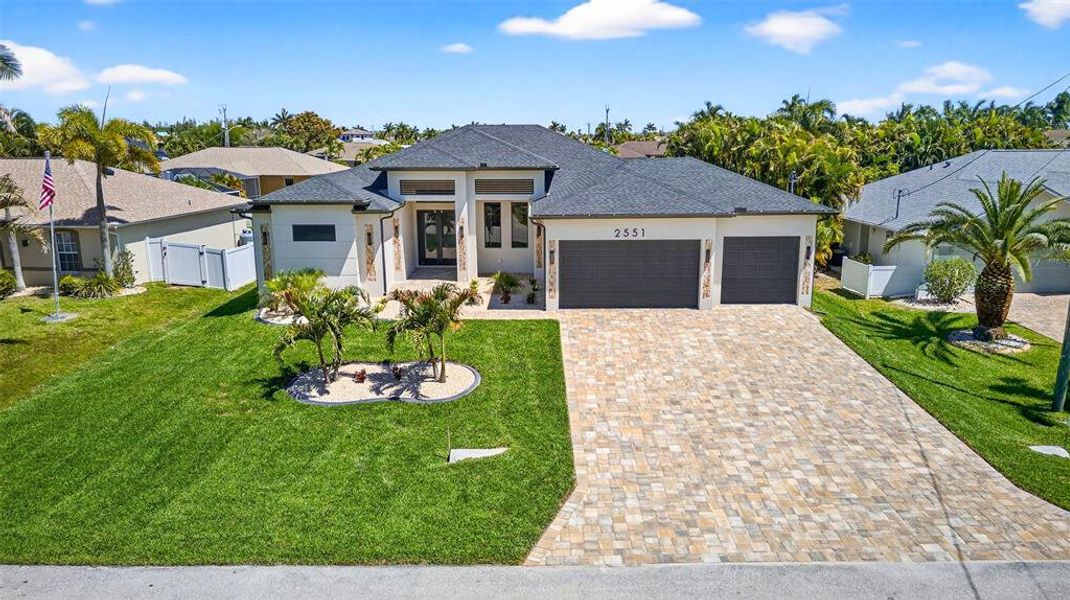 Front exterior of a new home in , Cape Coral, FL, highlighting curb appeal (Image 2). Front exterior of a new home in , Cape Coral, FL, highlighting curb appeal (Image 2).