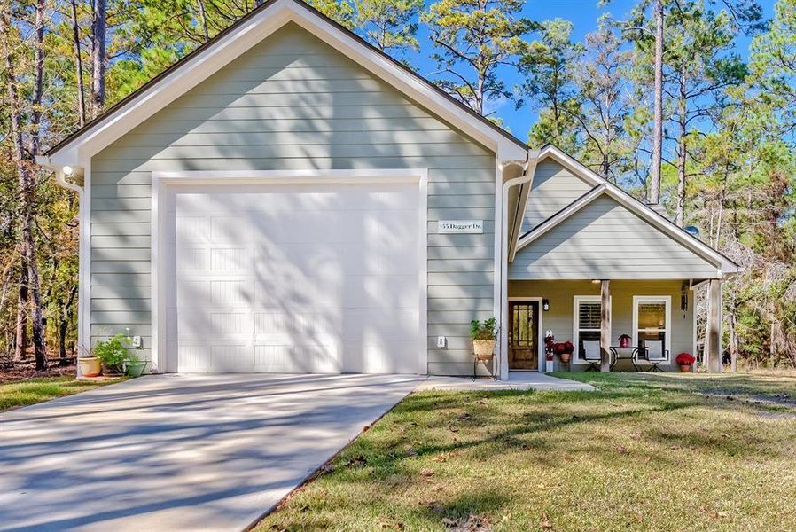 Front exterior of a new home in , Brookeland, TX, highlighting curb appeal (Image 22).