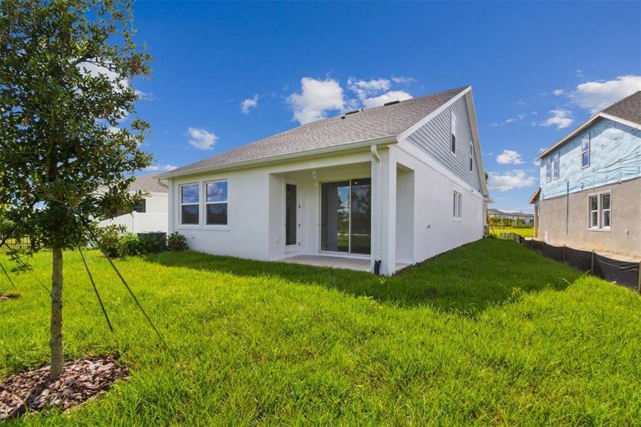 Exterior details and patio area of a home in Chapel Crossings - Garden Series, Wesley Chapel (Image 19).
