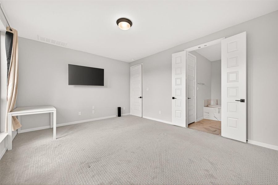 Spacious, unfurnished interior of a new home in Cane Island, Katy (Image 29).