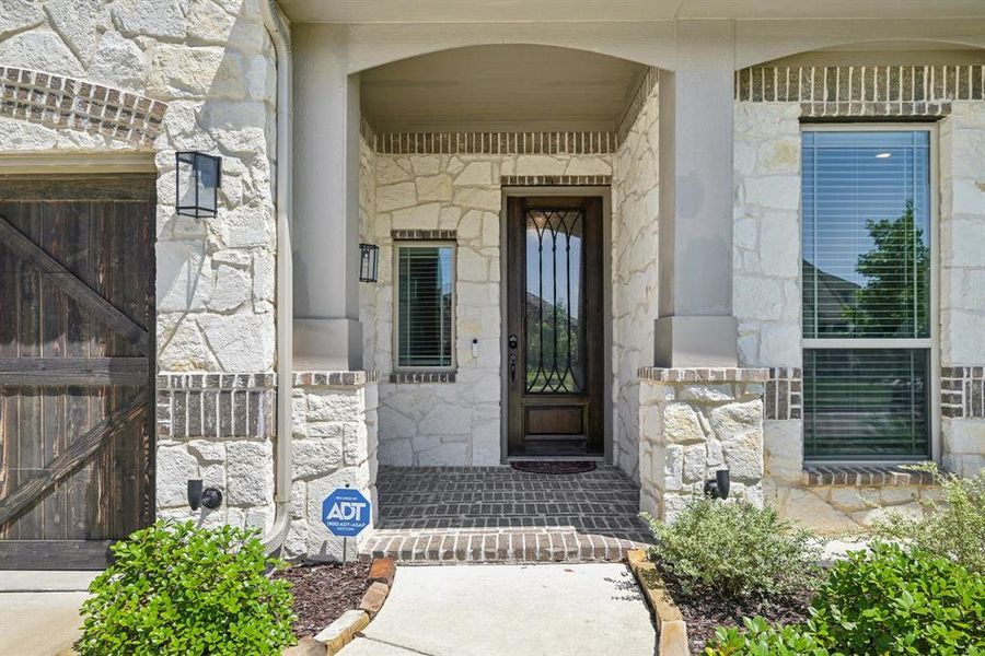 Property entrance with stone siding Property entrance with stone siding