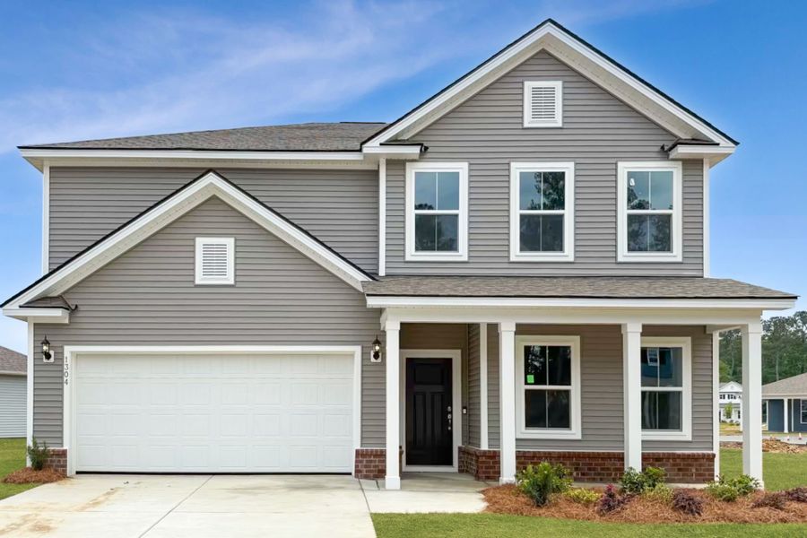 Front exterior of a new home in Solserra, Shallotte, NC, highlighting curb appeal (Image 17).