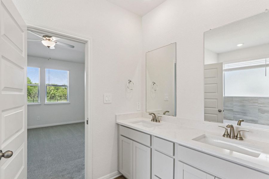 Bathroom with double vanity and a ceiling fan Bathroom with double vanity and a ceiling fan