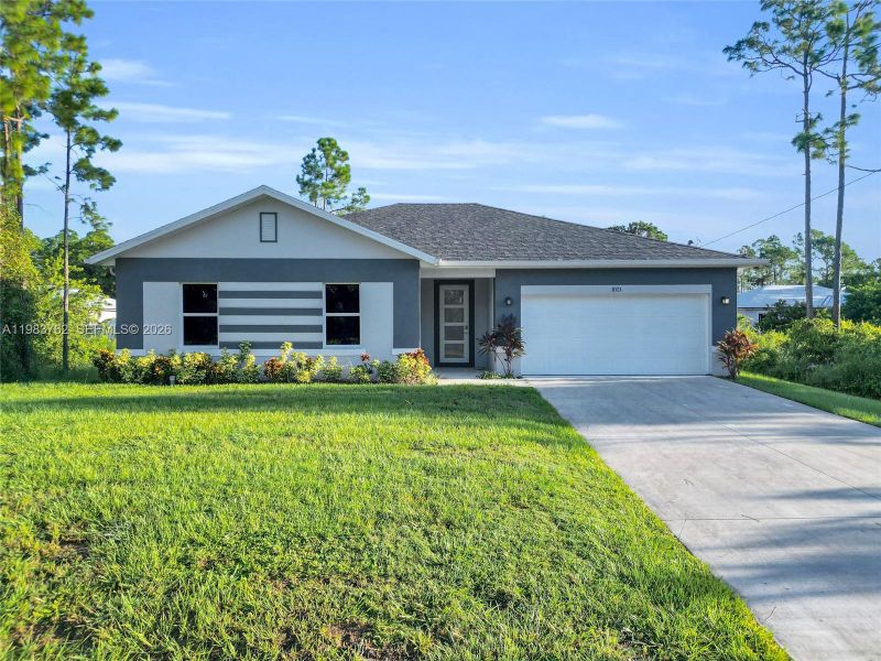 Front exterior of a new home in , Lehigh Acres, FL, highlighting curb appeal (Image 19).