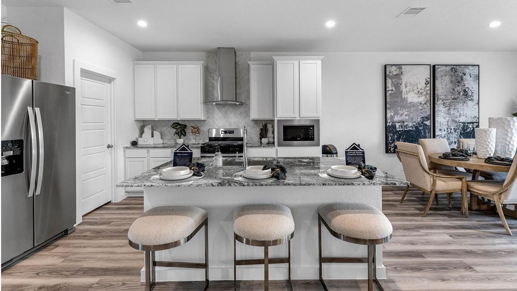 Representative photo. The kitchen serves as the heart of the home, seamlessly connecting to the dining and family areas creating an inviting environment for everything from casual evenings to entertaining guests. Representative photo. The kitchen serves as the heart of the home, seamlessly connecting to the dining and family areas creating an inviting environment for everything from casual evenings to entertaining guests.