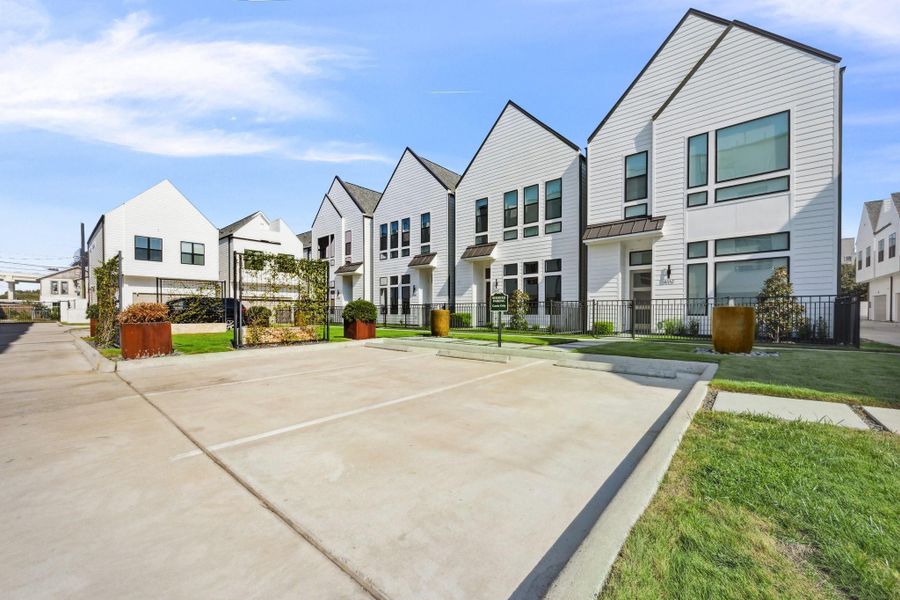 Front exterior of a new home in Point East, Houston, TX, highlighting curb appeal (Image 1). Front exterior of a new home in Point East, Houston, TX, highlighting curb appeal (Image 1).