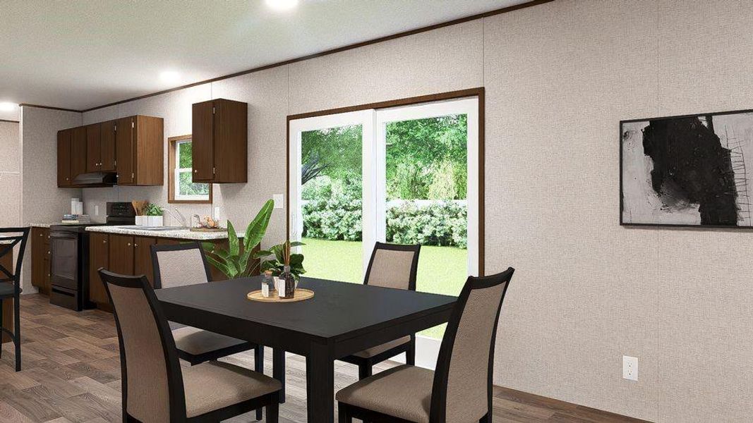 Open-concept dining area featuring wood-finish flooring, recessed lighting, and a sliding glass door to exterior Open-concept dining area featuring wood-finish flooring, recessed lighting, and a sliding glass door to exterior
