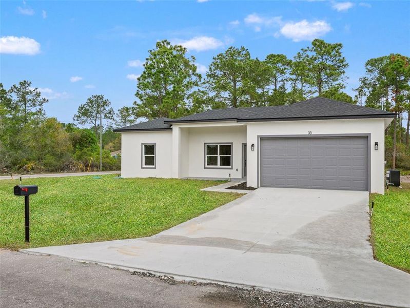 Front exterior of a new home in , Ocklawaha, FL, highlighting curb appeal (Image 18).