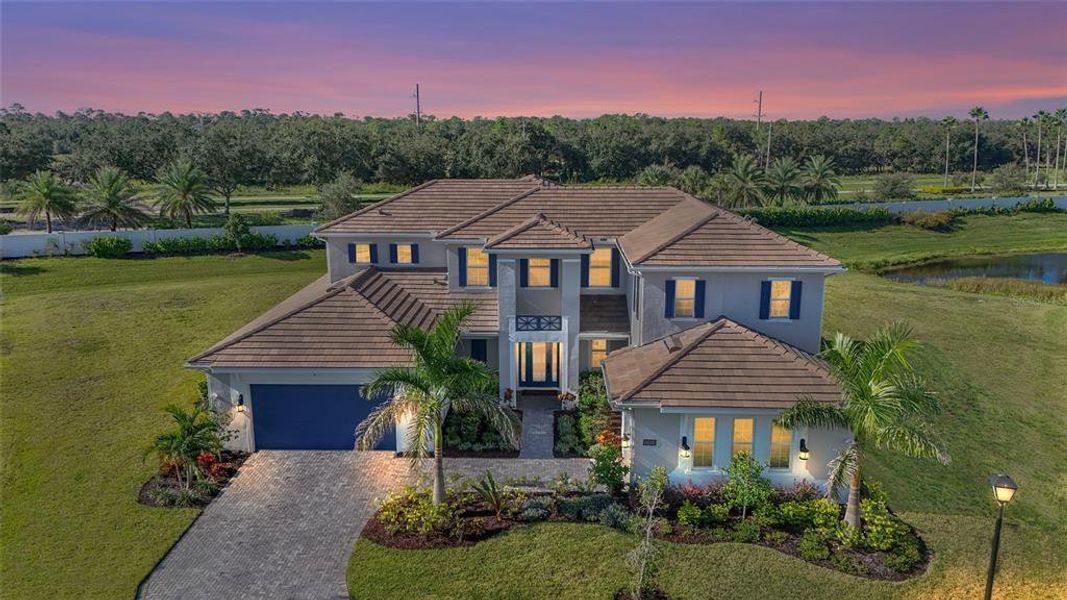 Front exterior of a new home in , Lakewood Ranch, FL, highlighting curb appeal (Image 21).