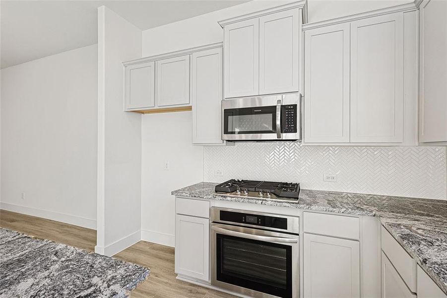 Furnished interior view inside a new home in Collin Creek, Plano (Image 12).