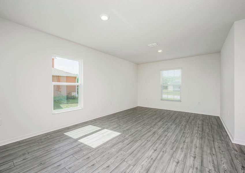 The dining room is spacious and has a lot of natural light