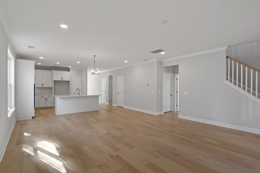 Spacious, unfurnished interior of a new home in K. Hovnanian's® Four Seasons at Lakes of Cane Bay, Summerville (Image 9).