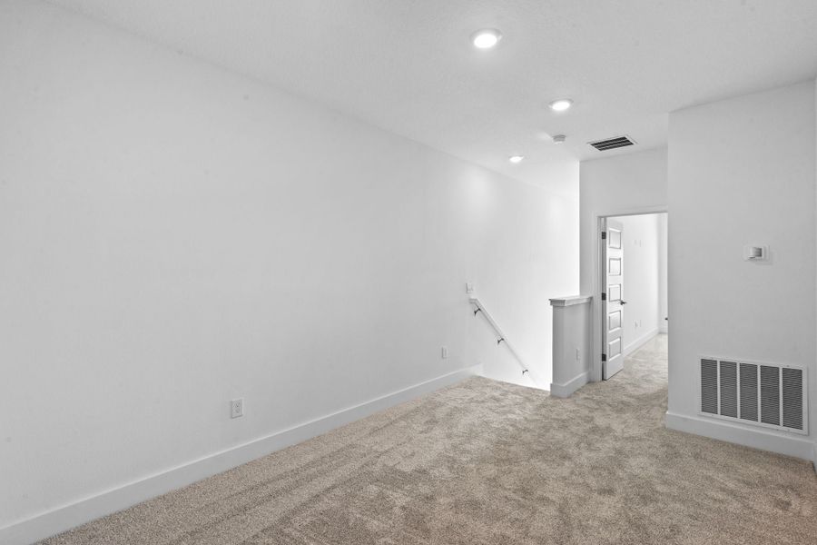 Representative unfurnished interior of a home built from the Edison by Rockwell Homes in Harvest at Ovation - Townhomes, Winter Garden (Image 85). Representative unfurnished interior of a home built from the Edison by Rockwell Homes in Harvest at Ovation - Townhomes, Winter Garden (Image 85).