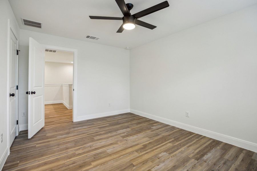 Bedroom 3 featuring baseboards, and visible vents