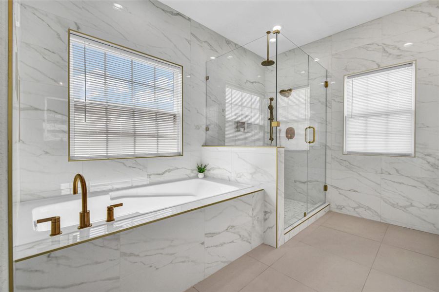 Primary bathroom shower and tub view Primary bathroom shower and tub view
