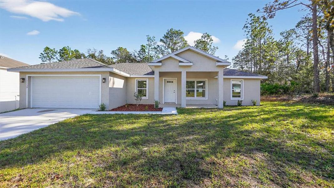 Front exterior of a new home in , Citrus Springs, FL, highlighting curb appeal (Image 1). Front exterior of a new home in , Citrus Springs, FL, highlighting curb appeal (Image 1).