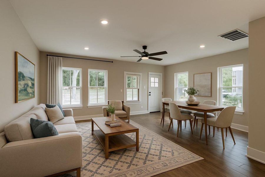Living area with wood finished floors, a ceiling fan, plenty of natural light, and recessed lighting