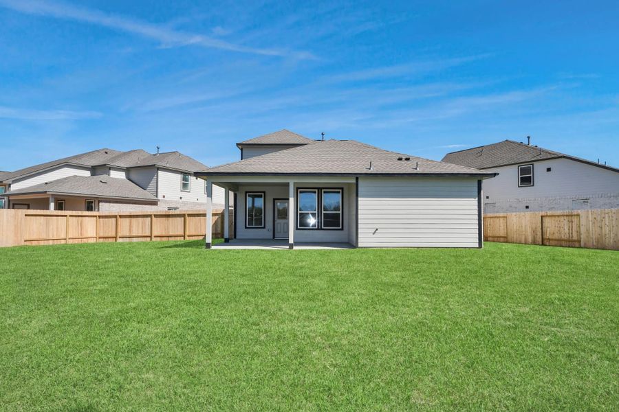 Experience outdoor living at its finest on this expansive covered patio, thoughtfully designed for BBQs and delightful outdoor dining.