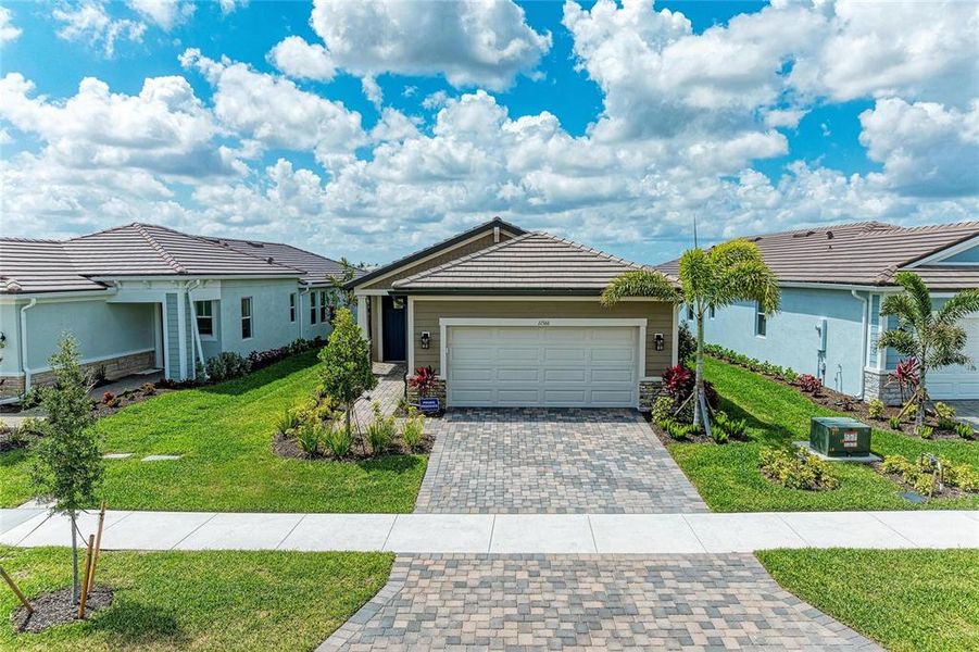 Front exterior of a new home in , Venice, FL, highlighting curb appeal (Image 27).