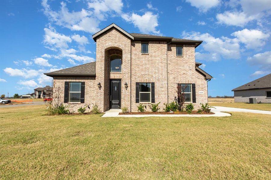 Front exterior of a new home in Stone Henge II, Sanger, TX, highlighting curb appeal (Image 16).