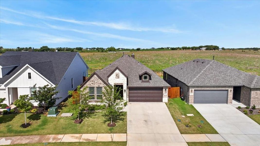Front exterior of a new home in , Godley, TX, highlighting curb appeal (Image 22).