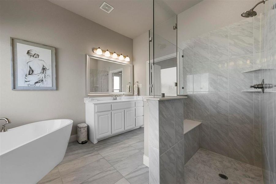 Bathroom with vanity and shower with separate bathtub