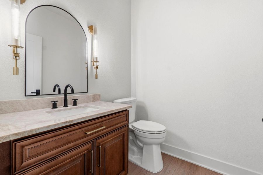 1/2 bath by laundry room and kitchen 1/2 bath by laundry room and kitchen