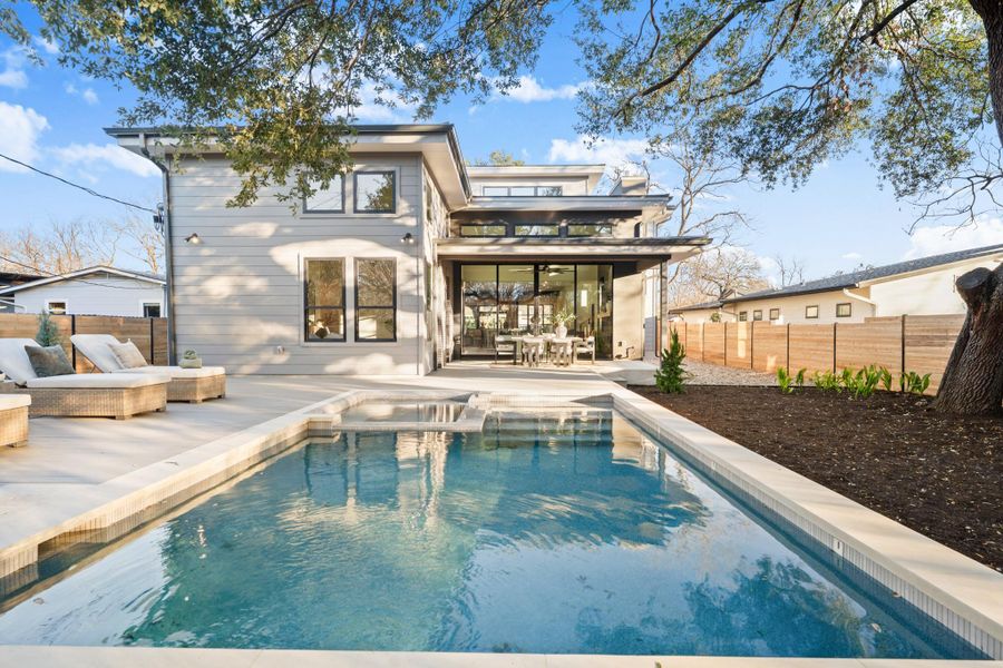 Rear view of property featuring a patio area and outdoor dining area