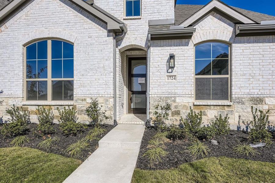 View of exterior entry featuring stone siding and brick siding View of exterior entry featuring stone siding and brick siding