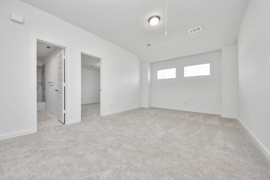 Discover a haven of leisure in this fantastic game room! Whether you're seeking a casual hangout or an adult gaming retreat, this space has it all. Enjoy the luxurious feel of plush carpet underfoot, the expansive ambiance of high ceilings, custom paint that adds a touch of personality, and windows that flood the room with refreshing natural light. Sample photo of completed home with similar floor plan. Actual colors and selections may vary. Discover a haven of leisure in this fantastic game room! Whether you're seeking a casual hangout or an adult gaming retreat, this space has it all. Enjoy the luxurious feel of plush carpet underfoot, the expansive ambiance of high ceilings, custom paint that adds a touch of personality, and windows that flood the room with refreshing natural light. Sample photo of completed home with similar floor plan. Actual colors and selections may vary.