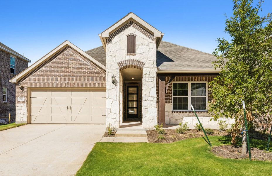 The Arlington, a one-story home with 2-car garage, shown with Home Exterior D