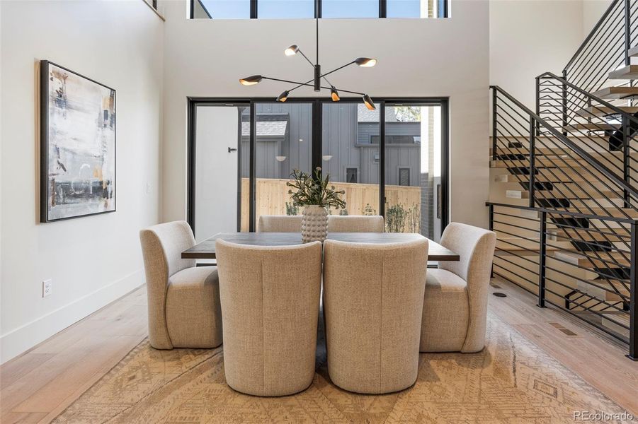 Dining area with soaring double height ceilings