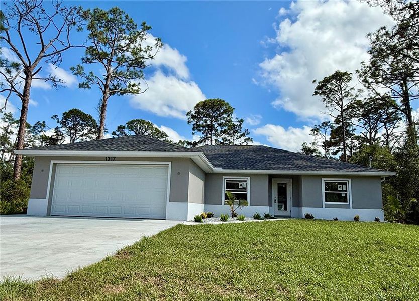 Front exterior of a new home in , Port Charlotte, FL, highlighting curb appeal (Image 19).