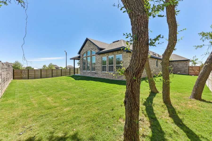 Exterior details and patio area of a home in Highland Village, Georgetown (Image 25).