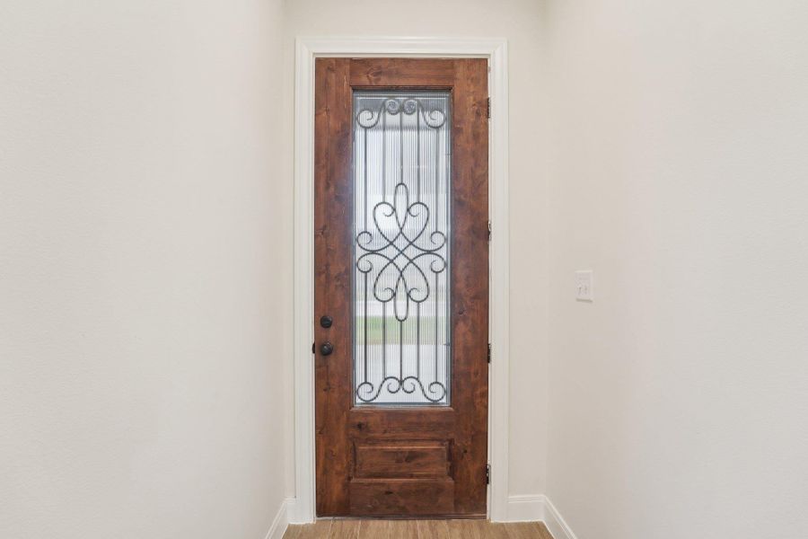 Entrance foyer with wood plank tile floor Entrance foyer with wood plank tile floor