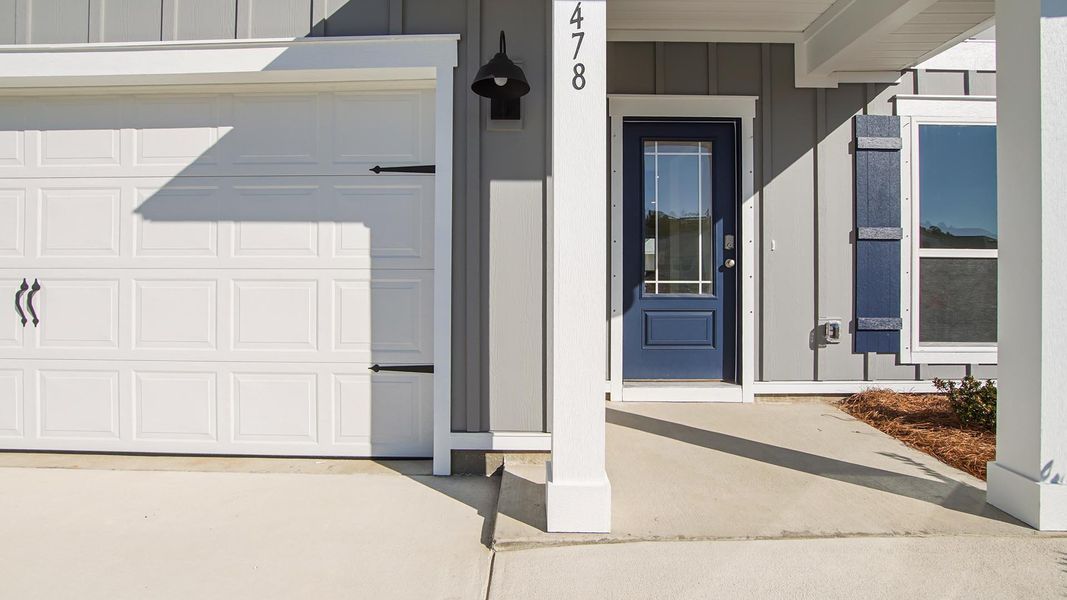 Front exterior of a new home in Bayside at Ward Creek, Panama City Beach, FL, highlighting curb appeal (Image 2). Front exterior of a new home in Bayside at Ward Creek, Panama City Beach, FL, highlighting curb appeal (Image 2).