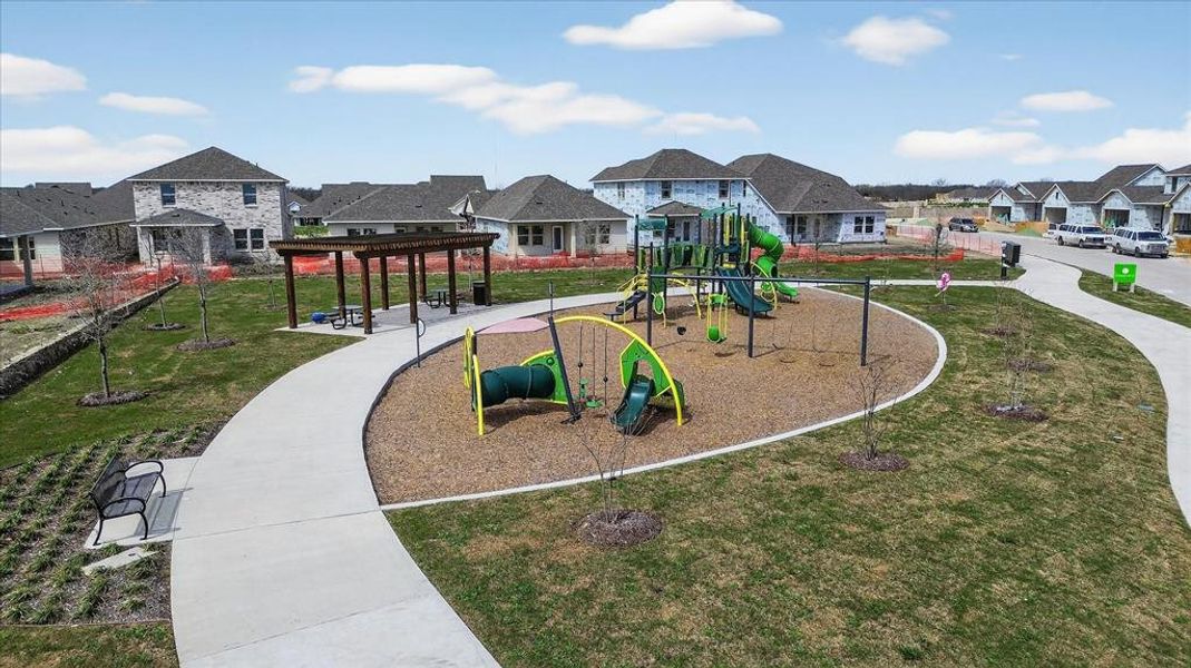 Community play area with a residential view, a yard, and a pergola