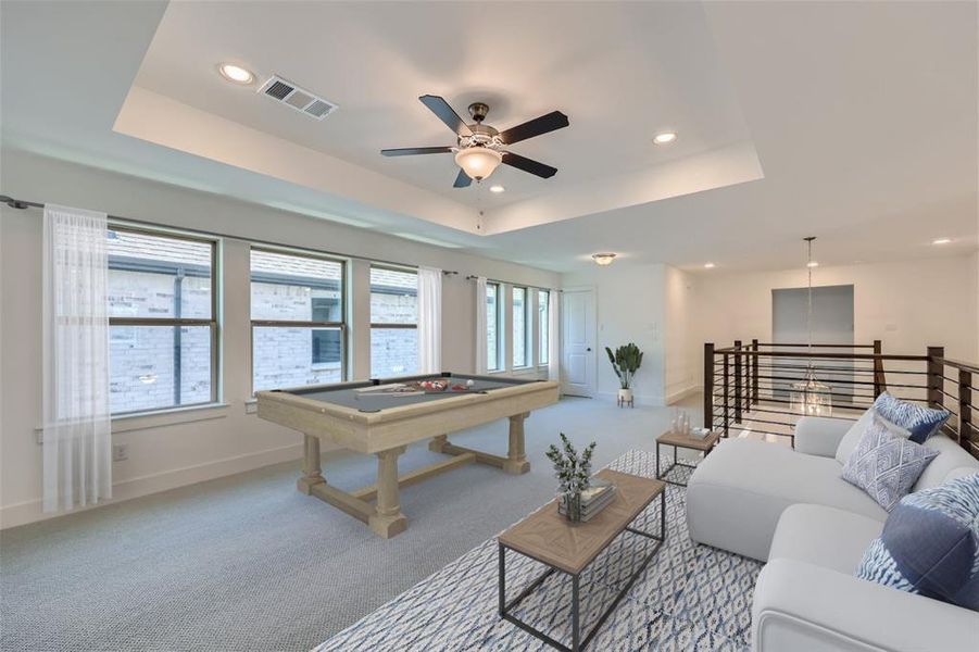 Virtually Staged Photo - Recreation room with carpet floors, ceiling fan, a tray ceiling, and pool table