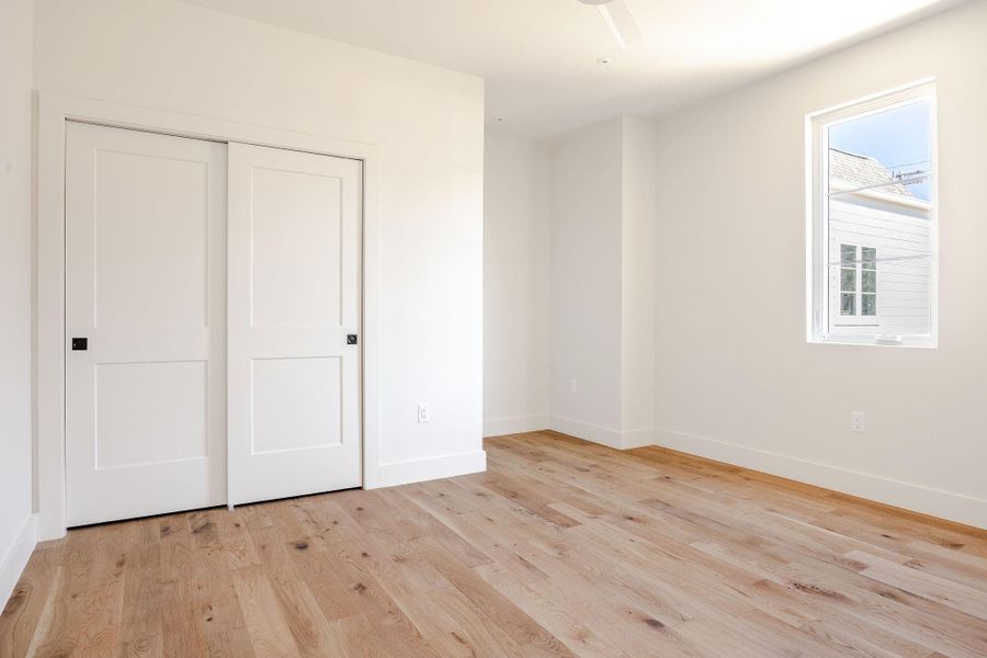 Secondary bedroom features a desk nook.