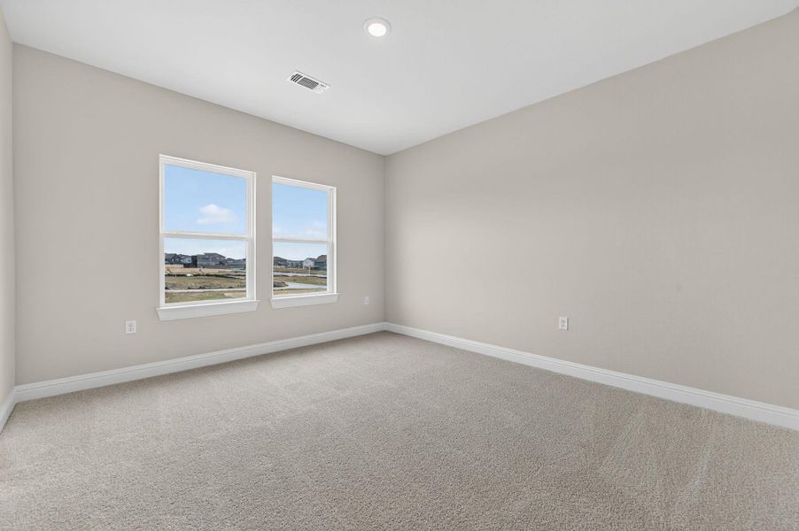 Unfurnished room featuring light colored carpet and recessed lighting
