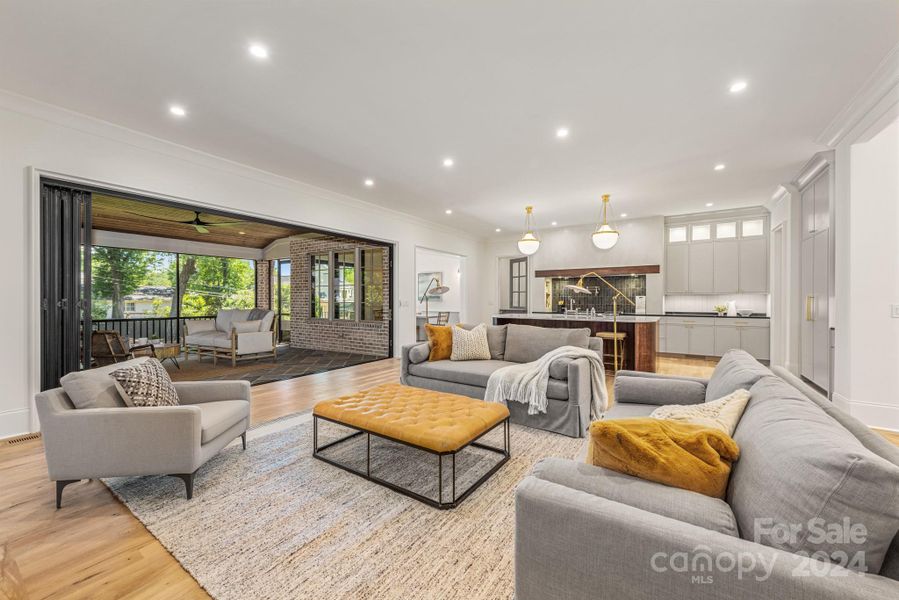 Accordion doors opening up to the screen porch allows for great indoor/outdoor living