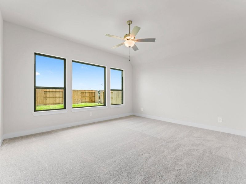 Primary Bedroom with Walk-in Closet and Fan Primary Bedroom with Walk-in Closet and Fan