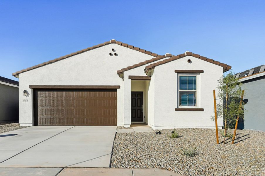 Spanish Exterior Elevation. Colors and finishes may vary by community